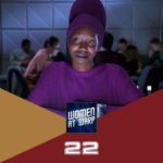 Guinan in purple outfit