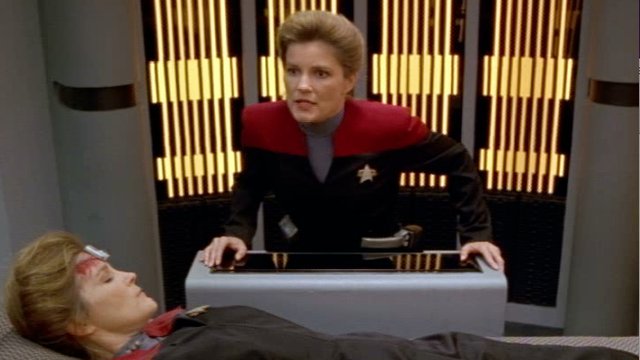 Janeway looks at herself, apparently dead in Sickbay