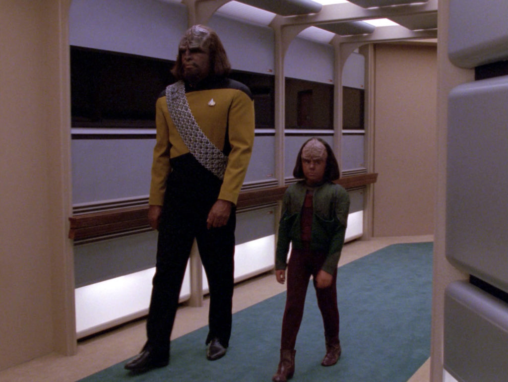 Worf walks Alexander down the hall in "New Ground"