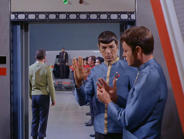 Spock shows McCoy the Vulcan salute in "Journey to Babel"