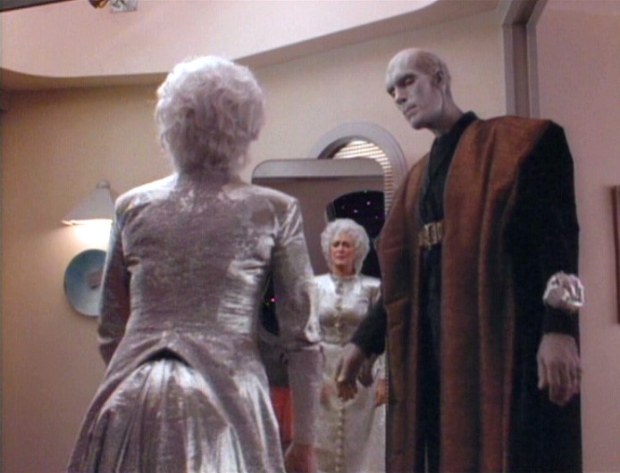 Lwaxana in silver-grey dress and white wig