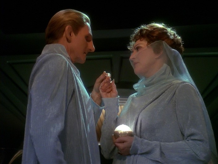 Lwaxana and Odo in their wedding outfits