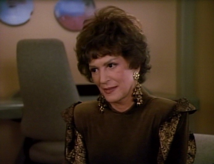 Lwaxana in dark green in "Half a Life"