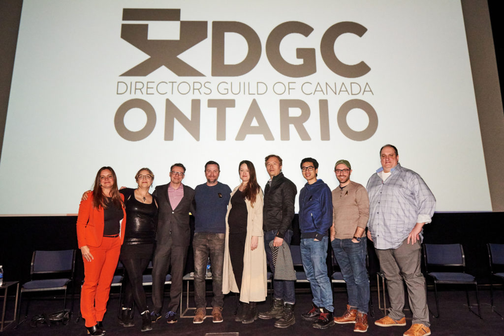 The panel stands in front of the Directors Guild of Canada: Ontario logo