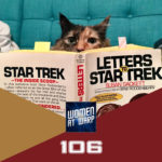 Photo of a cat reading Letters to Star Trek