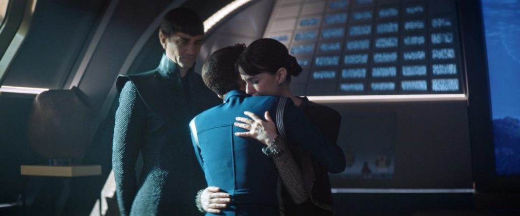 Amanda tearfully embraces Michael as Sarek watches