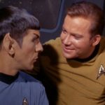 Spock and Kirk chatting, Kirk's arm around Spock