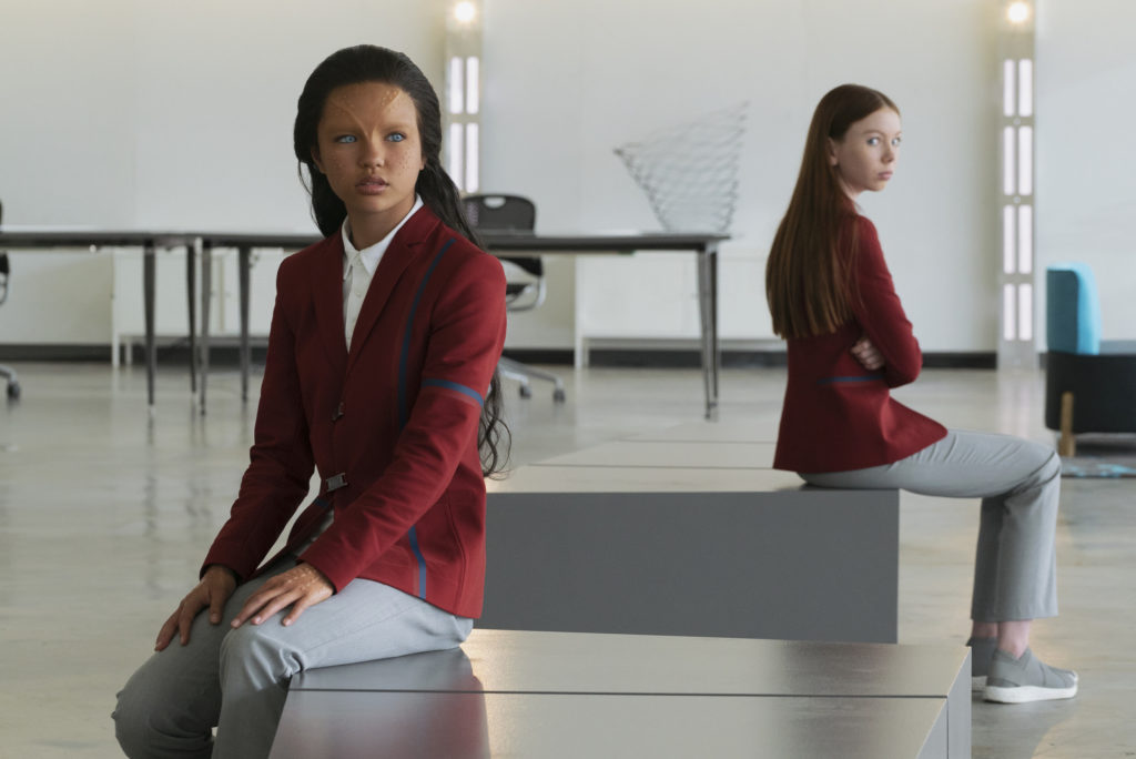 Two girls in futuristic school uniforms