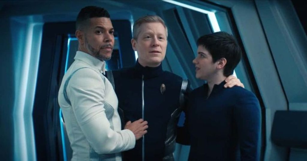 Hugh, Stamets and Adira with their arms around each other