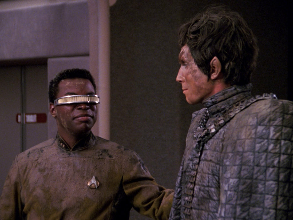 Geordi and Bochra smile at each other on the bridge after being rescued