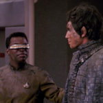Geordi and Bochra smile at each other on the bridge after being rescued