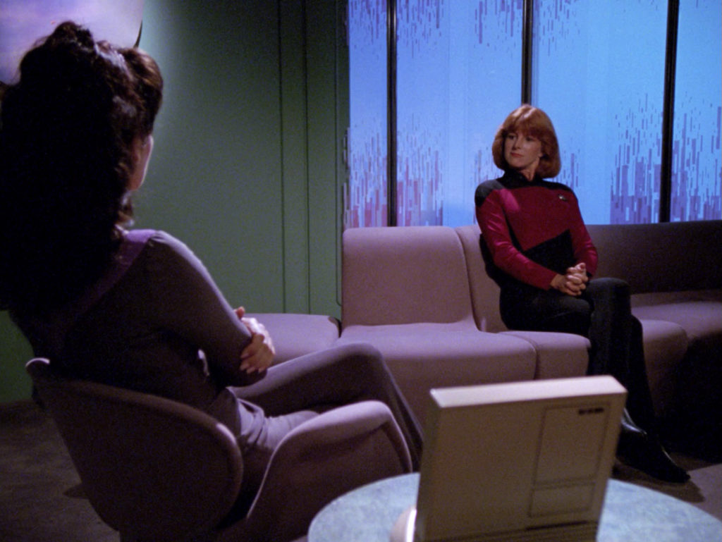 Troi speaks with her client in "The Loss"