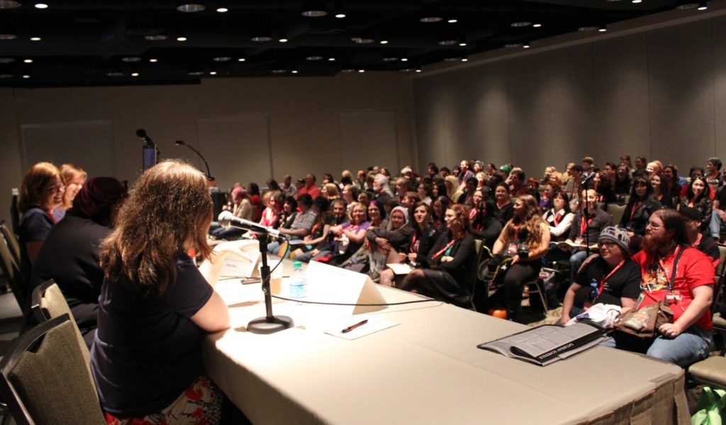 Audience at a convention panel.