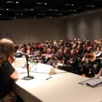 Audience at a convention panel.