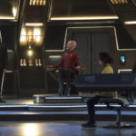 Tarka and Stamets on the Discovery bridge with Saru in the Captain's chair