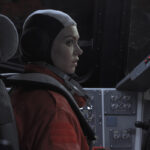 Renee Picard in her flight suit in the cabin of a spacecraft