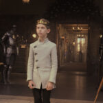 Young Picard wearing a crown