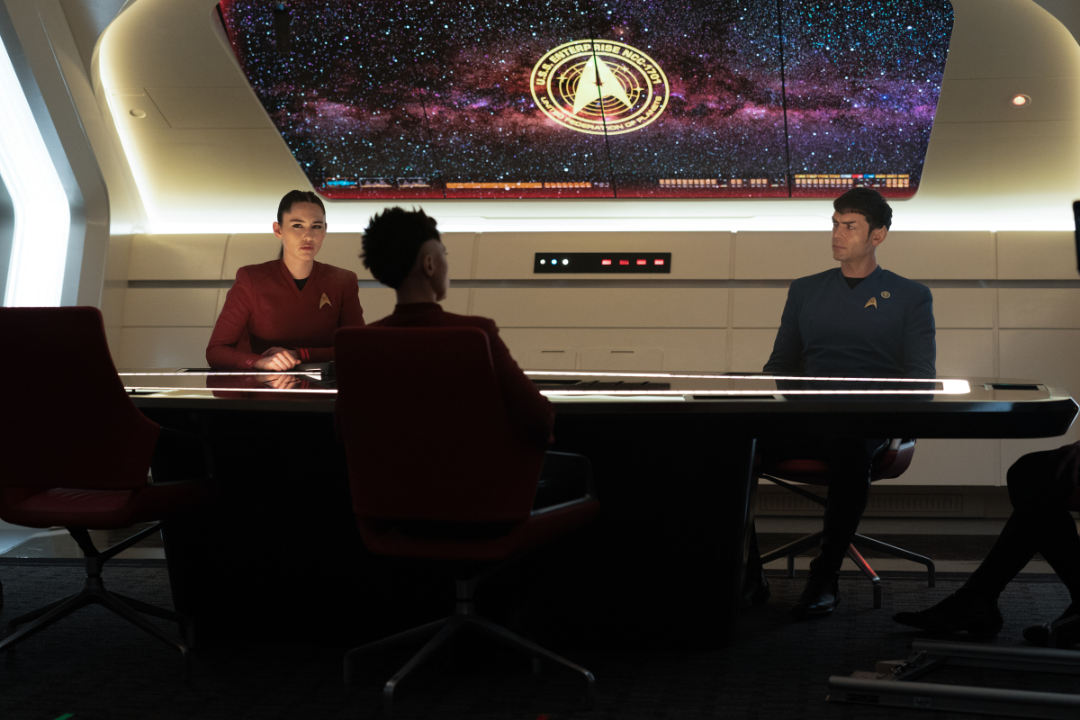 Noonien-Singh, Ortegas, and Spock in the conference room.