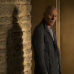 Picard beside the wall of the chateau where the key to his mother's room was hidden