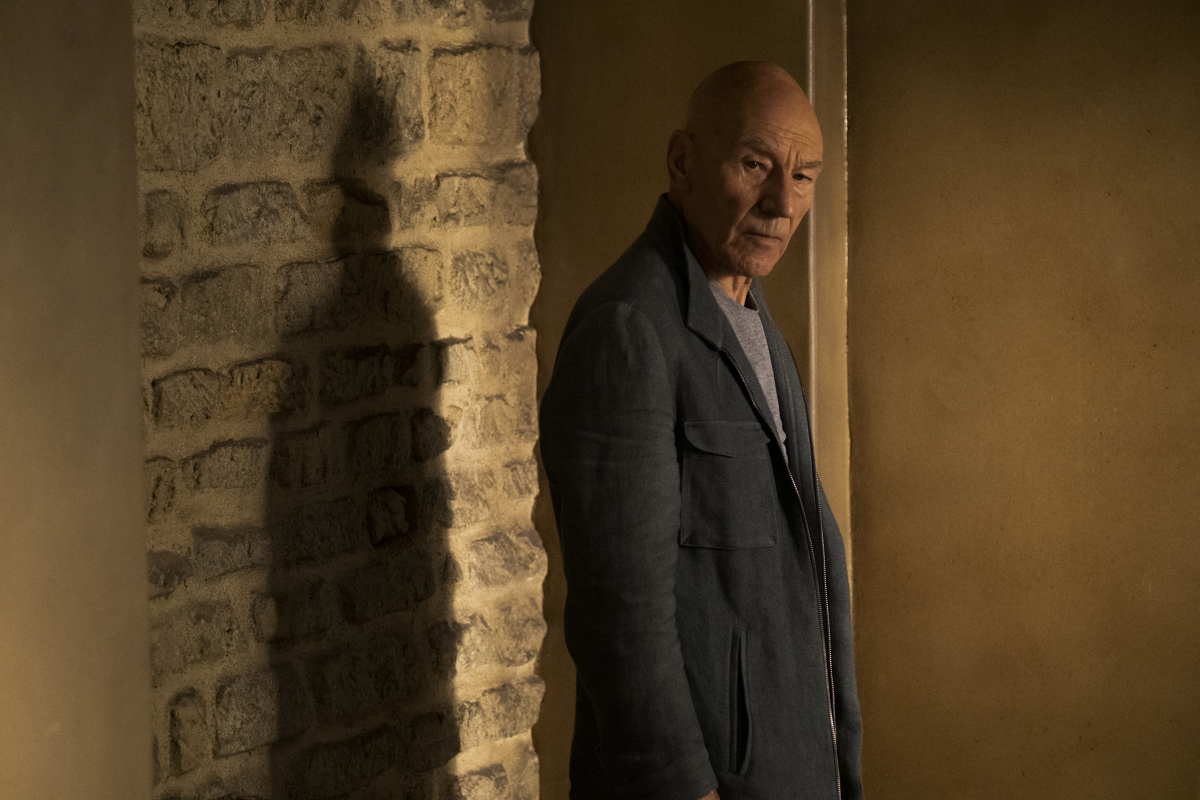 Picard beside the wall of the chateau where the key to his mother's room was hidden
