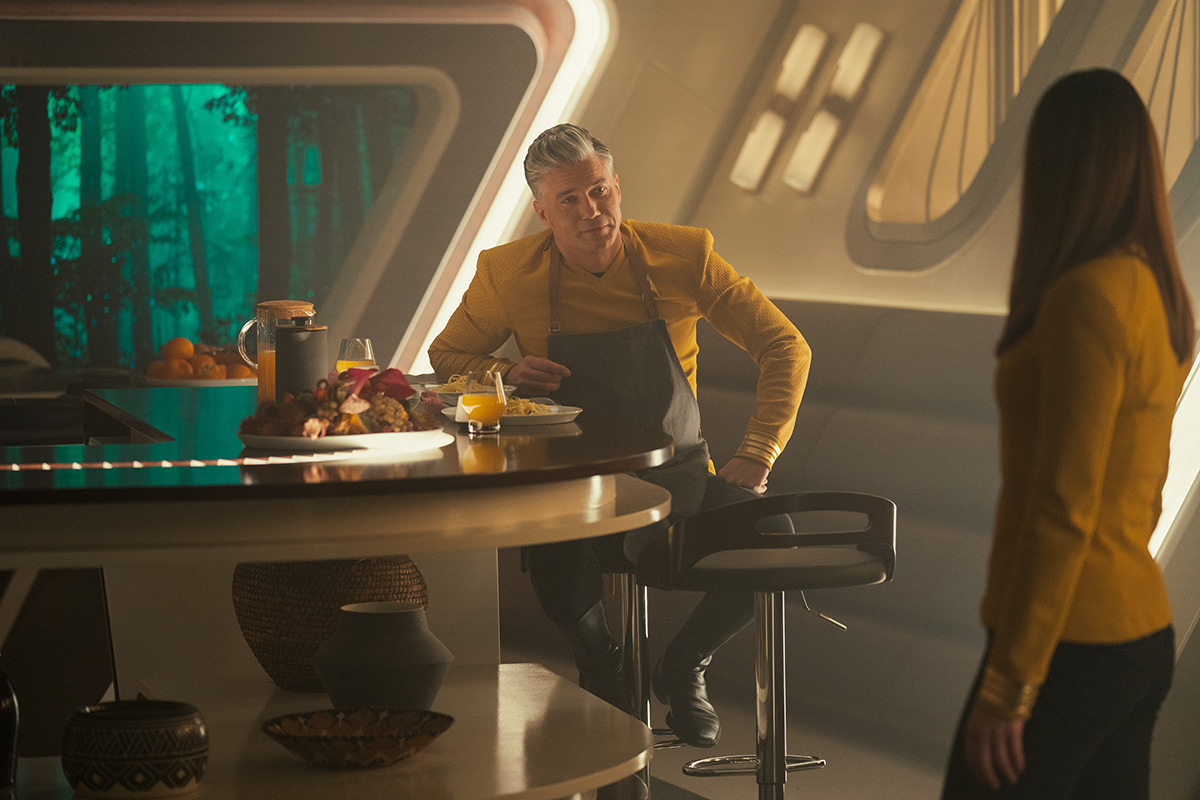 Captains Pike and Batel in his quarters.