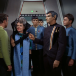 Sarek and Amanda touch fingers in front of Kirk, Spock and McCoy ("Journey to Babel")