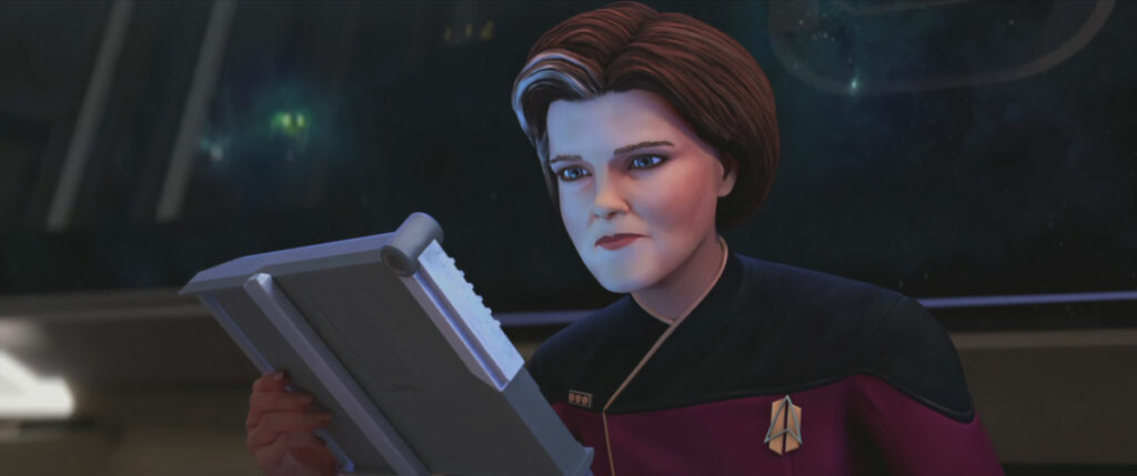 Janeway studies a padd