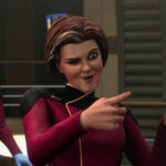 Dal (in Janeway's body) makes finger guns on the bridge