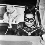 Eartha Kitt as Catwoman with a cat on a leash