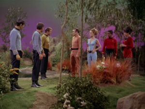 Kirk, McCoy and Spock talk with Rojan and Kelinda, with two redshirts in the background, in "By Any Other Name"