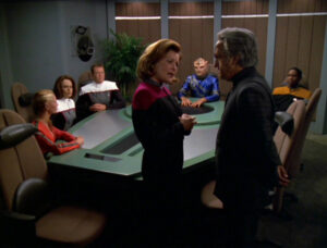 Janeway negotiates about the upcoming race, in the conference room in the episode "Drive"