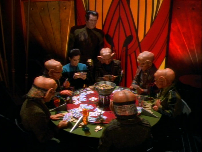 Pel and Dax play tonga with a group of Ferengi men