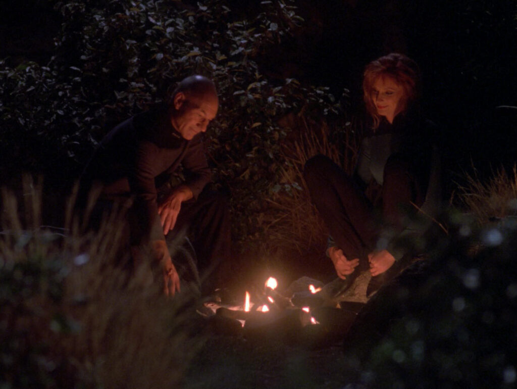 Picard and Crusher around the campfire in "Attached"