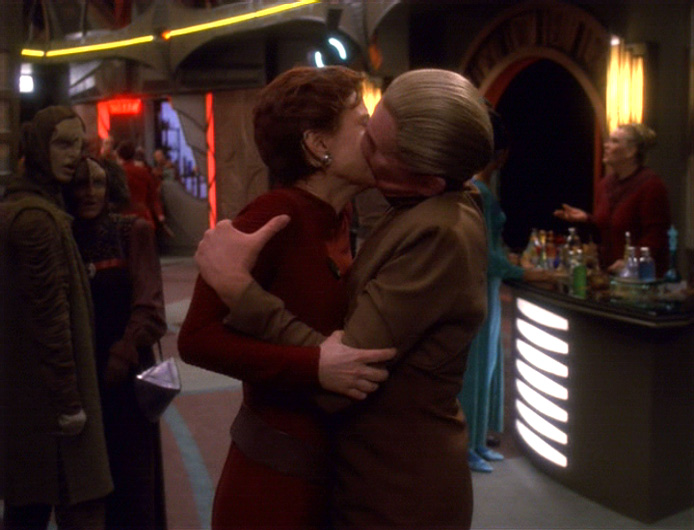 Odo and Kira kiss on the Promenade in "His Way"