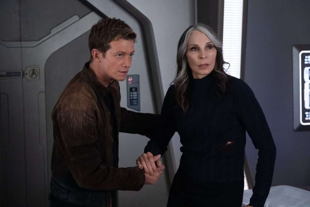Jack helping Beverly up after being injured at the beginning of Season 3, in sickbay