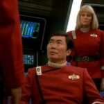 Tuvok speaks to Sulu in "Flashback," Rand stands behind him