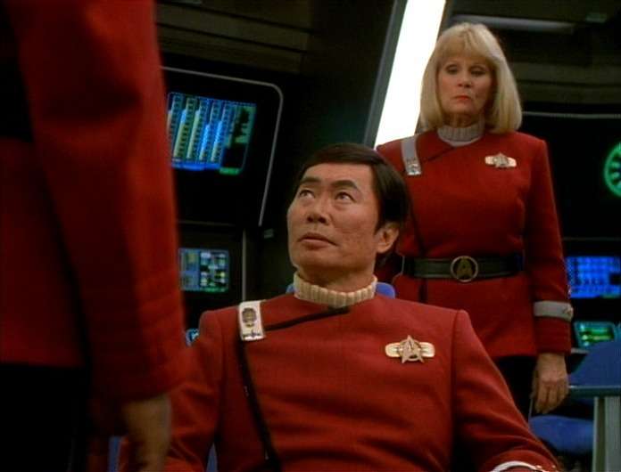 Tuvok speaks to Sulu in "Flashback," Rand stands behind him
