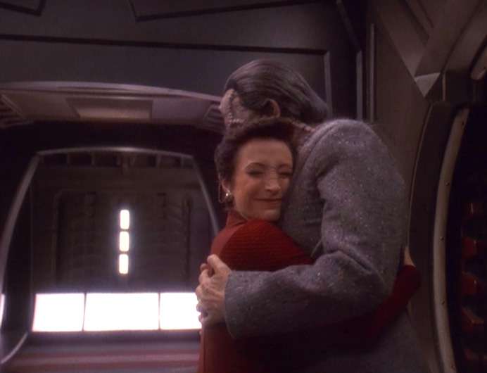 Ghemor and Kira embrace as he steps off his ship at DS9