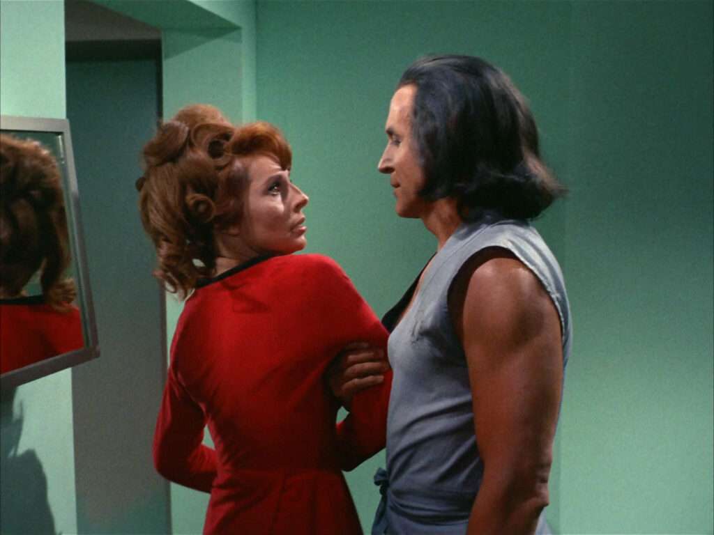 Khan holds Marla by the arm in Sickbay