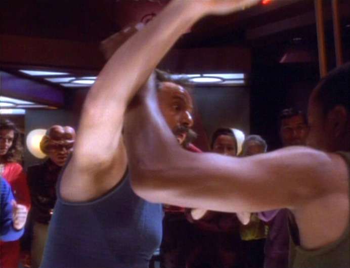 Q gets punched by Sisko