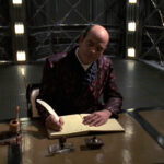 The Doctor at his writing desk in the holodeck ("Author, Author")