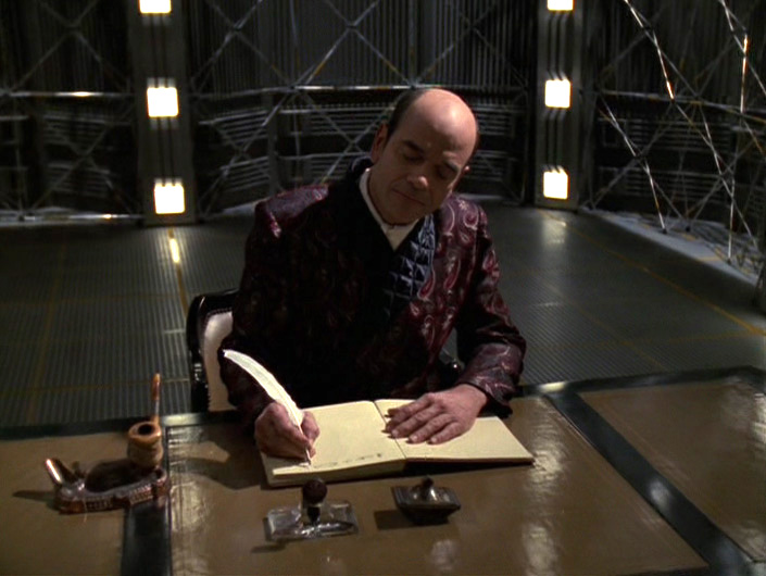 The Doctor at his writing desk in the holodeck ("Author, Author")