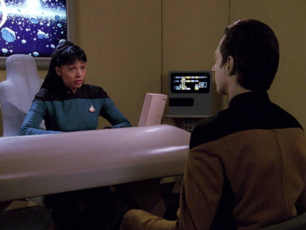 Lieutenant Ballard speaks with Data